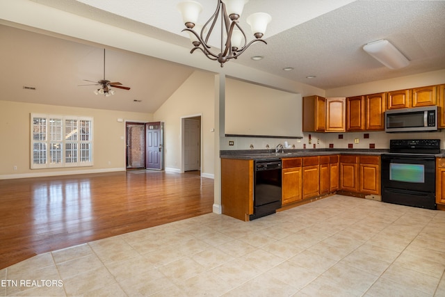 kitchen featuring ceiling fan with notable chandelier, a textured ceiling, black appliances, decorative light fixtures, and light hardwood / wood-style floors