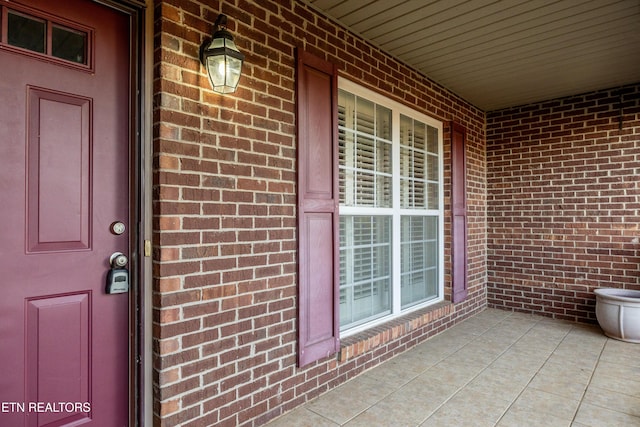 doorway to property with a porch