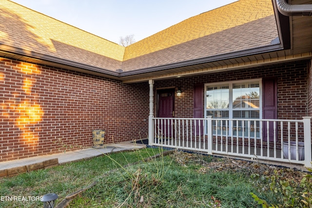 doorway to property featuring covered porch