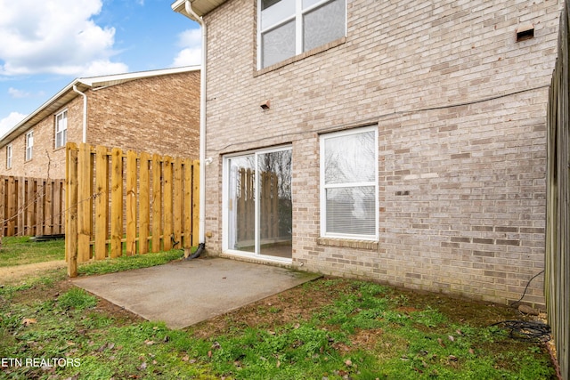 rear view of property featuring a patio area