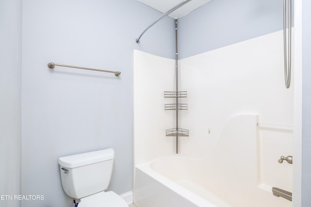 bathroom featuring toilet and shower / tub combination