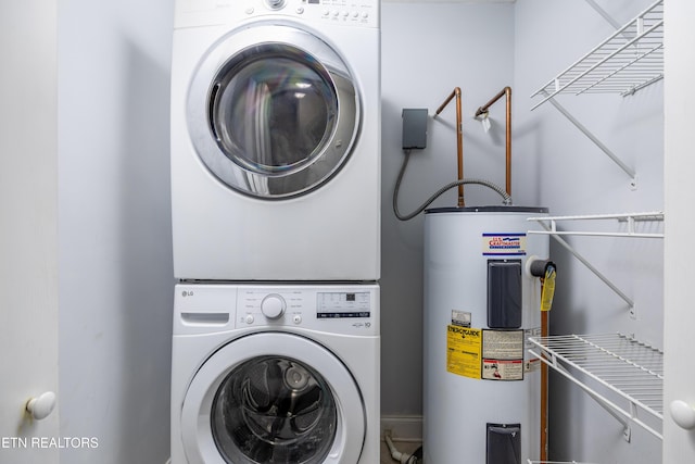 laundry area featuring stacked washer and clothes dryer and water heater