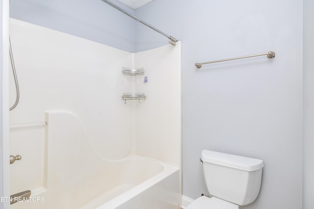 bathroom featuring bathing tub / shower combination and toilet