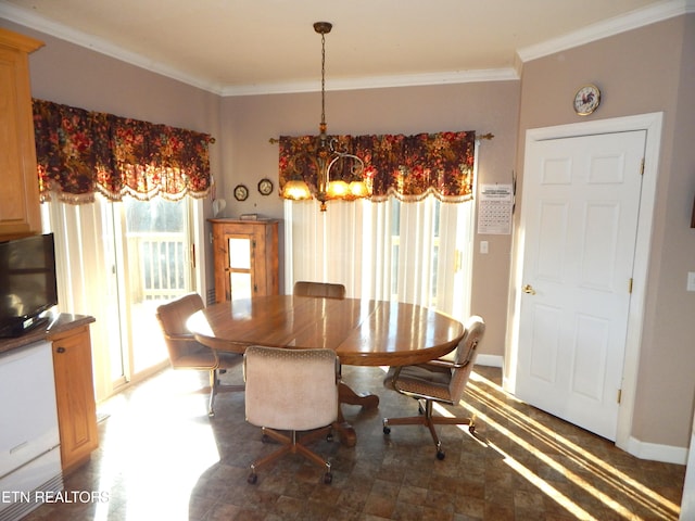 dining area featuring ornamental molding and a notable chandelier