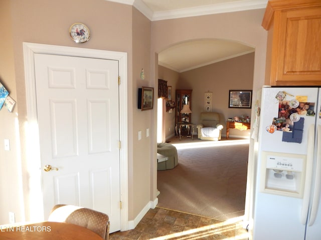 interior space featuring carpet flooring and ornamental molding