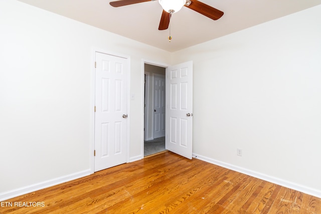 unfurnished room with ceiling fan and light wood-type flooring