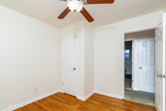 spare room featuring ceiling fan and wood-type flooring