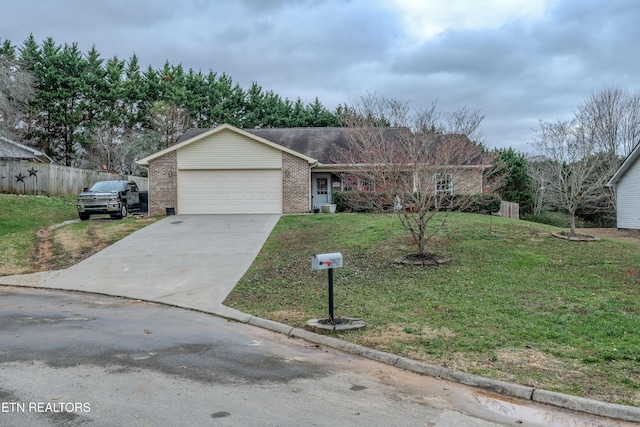 view of front facade with a garage and a front lawn