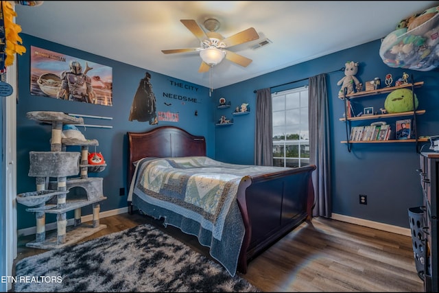 bedroom featuring dark hardwood / wood-style flooring and ceiling fan