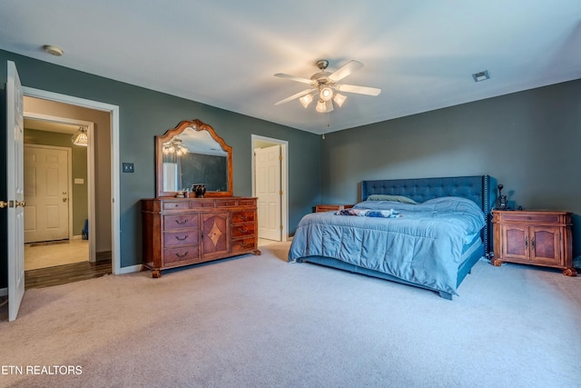 carpeted bedroom featuring ceiling fan