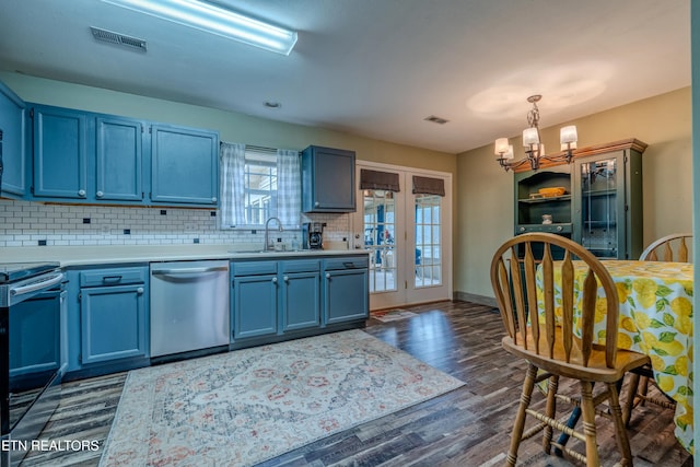 kitchen featuring stainless steel dishwasher, blue cabinets, sink, range, and dark hardwood / wood-style floors