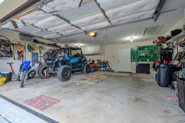 garage featuring a garage door opener