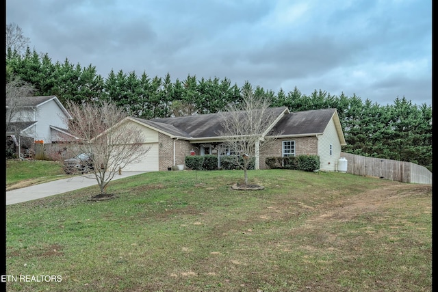 view of front of home featuring a garage and a front yard