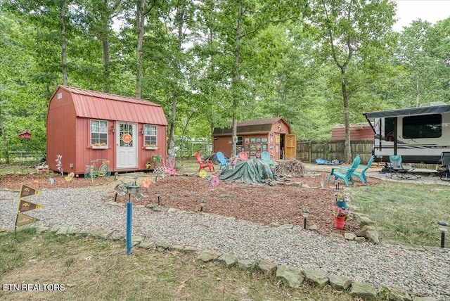 view of jungle gym featuring a shed