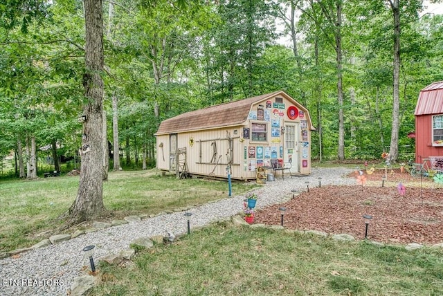 view of outbuilding with a lawn