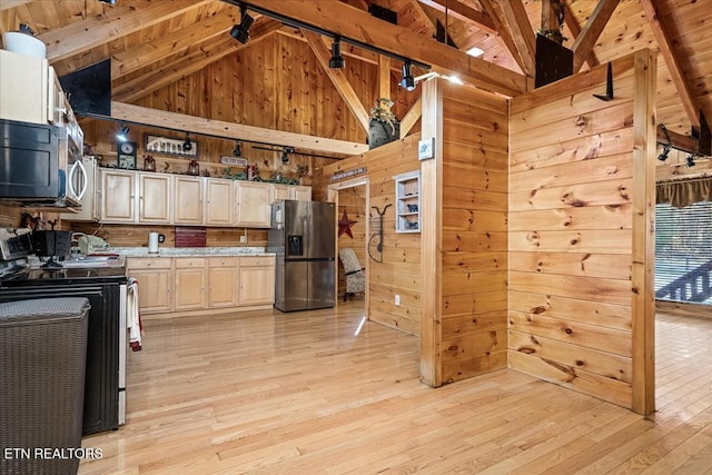 kitchen featuring beamed ceiling, stainless steel appliances, high vaulted ceiling, and light hardwood / wood-style floors