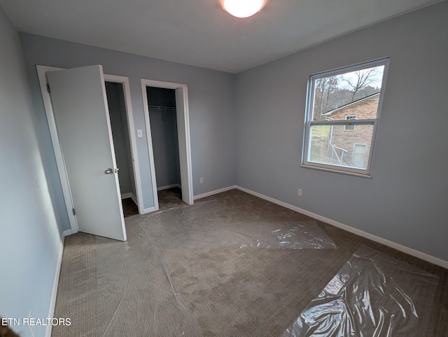 unfurnished bedroom featuring carpet flooring