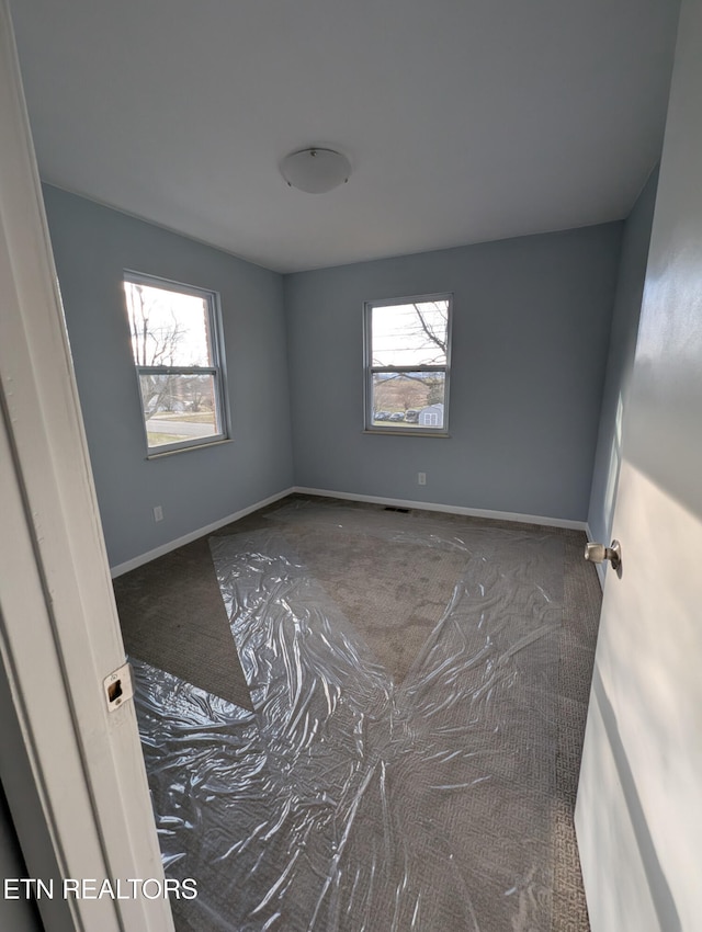 view of carpeted spare room