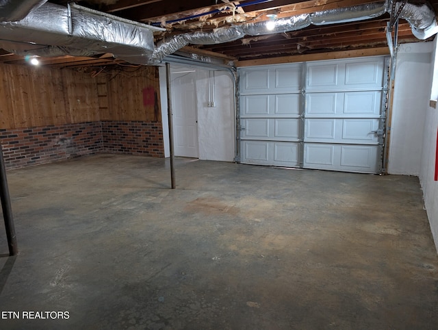 basement featuring brick wall