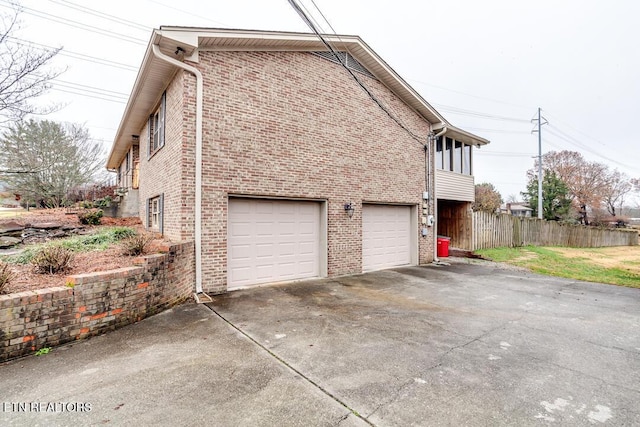 view of side of property featuring a garage