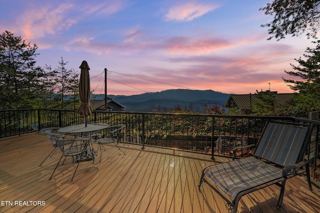 deck at dusk with a mountain view