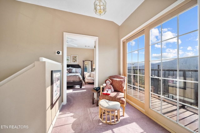 living area featuring a mountain view and carpet floors