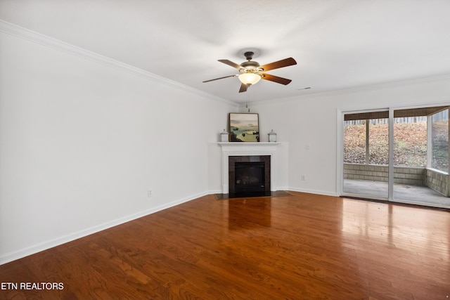 unfurnished living room featuring wood-type flooring, ceiling fan, and ornamental molding