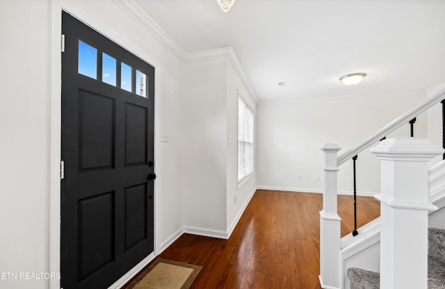 entrance foyer featuring crown molding and dark hardwood / wood-style floors