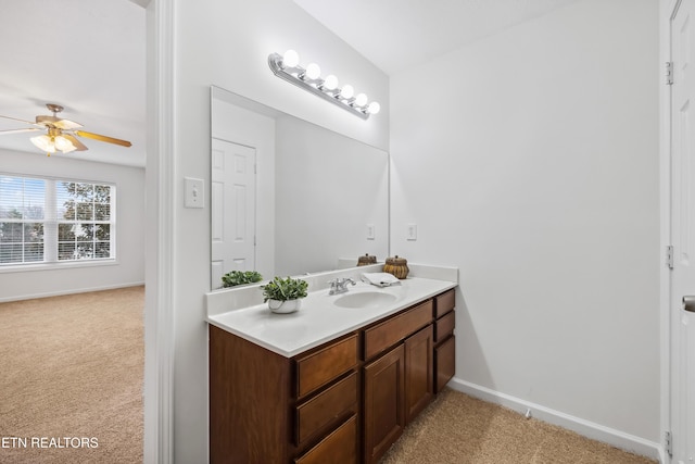 bathroom featuring ceiling fan and vanity