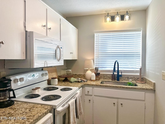 kitchen with sink, white cabinetry, light stone countertops, white appliances, and a textured ceiling