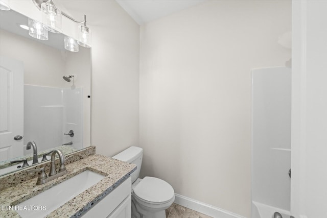 full bathroom featuring washtub / shower combination, vanity, and toilet