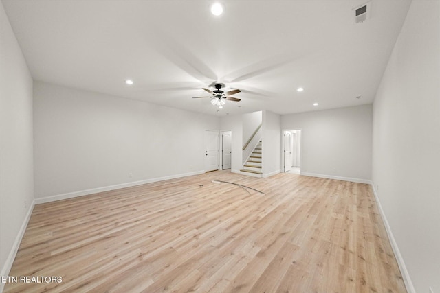 interior space with light wood-type flooring and ceiling fan