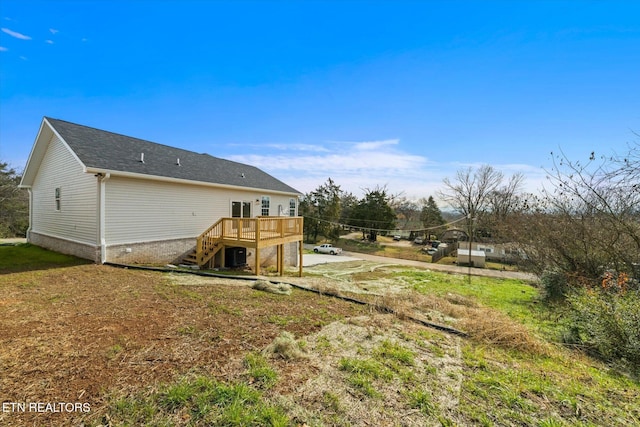 rear view of house featuring a deck