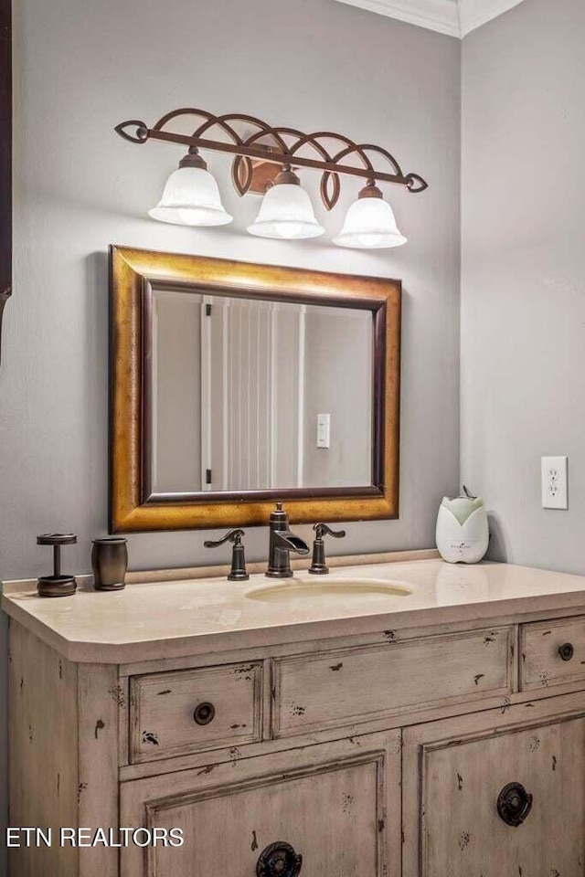 bathroom with vanity and crown molding