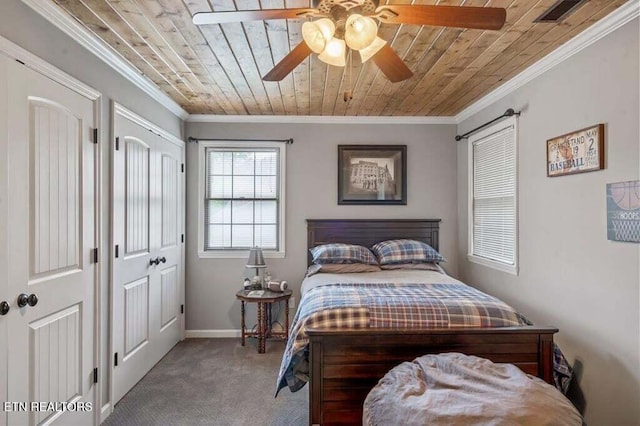 carpeted bedroom featuring ceiling fan, wood ceiling, and ornamental molding