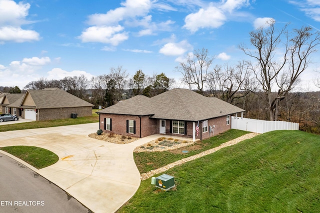 single story home featuring a front lawn