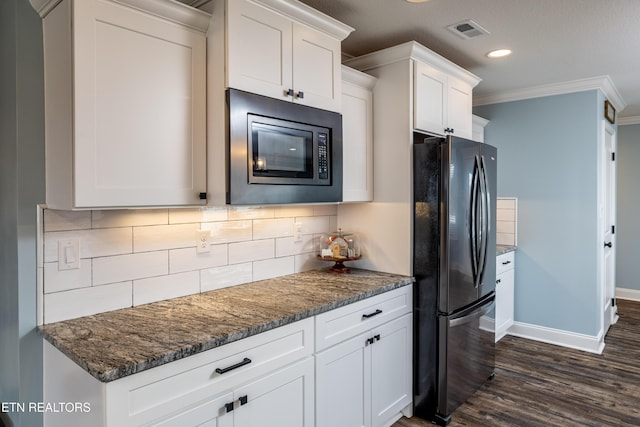 kitchen featuring black refrigerator, white cabinets, built in microwave, and crown molding