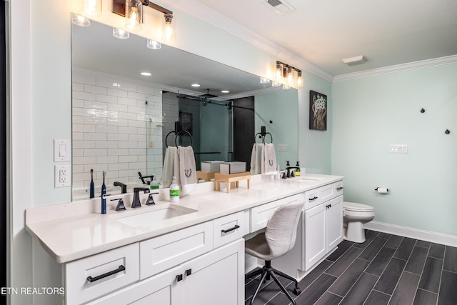 bathroom featuring an enclosed shower, ornamental molding, vanity, hardwood / wood-style flooring, and toilet