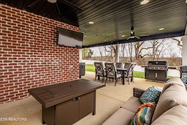 view of patio / terrace featuring ceiling fan, a grill, and an outdoor hangout area