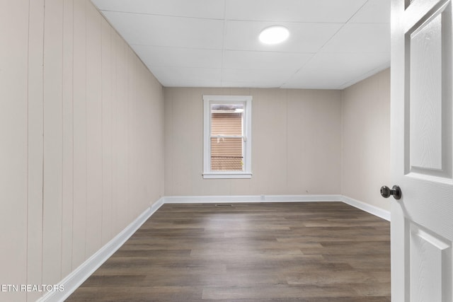 spare room with dark wood-type flooring