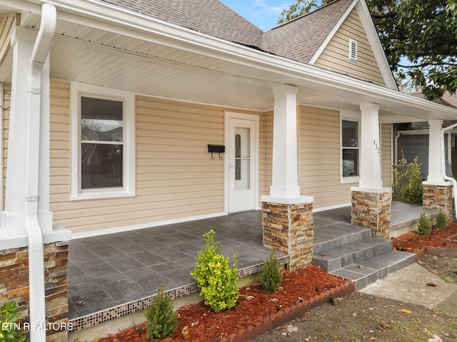 property entrance featuring covered porch