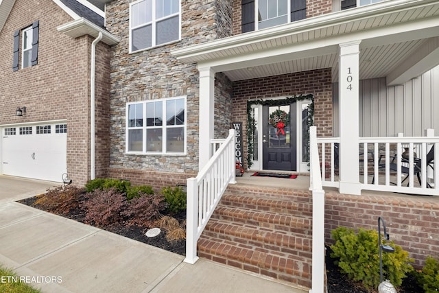 view of exterior entry with a garage