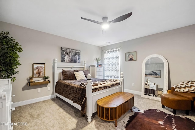 bedroom with ceiling fan and light carpet