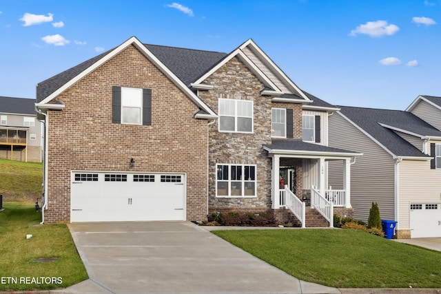 view of front of home featuring a garage and a front yard