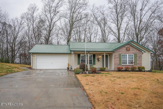 ranch-style house with a front yard and a garage