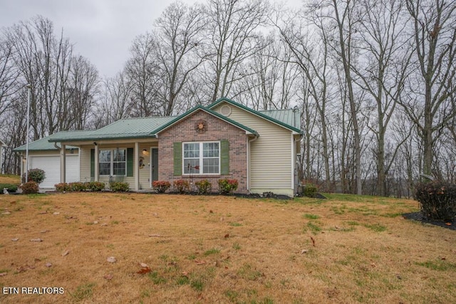 ranch-style house with a garage and a front lawn