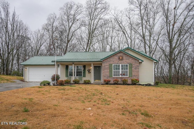 ranch-style house with a garage and a front lawn