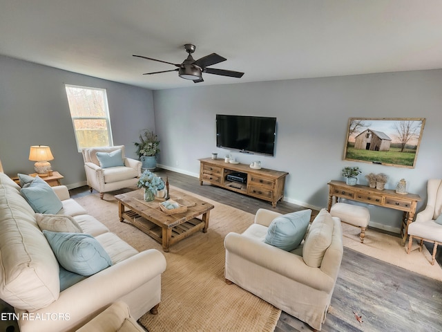 living room with ceiling fan and light hardwood / wood-style floors