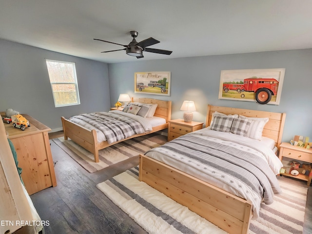 bedroom featuring ceiling fan and dark hardwood / wood-style floors