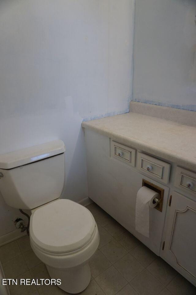 bathroom featuring tile patterned floors and toilet